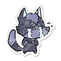 distressed sticker of a cartoon crying wolf