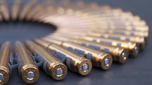 Sniper or machine gun ammo belts on a production line. Deadly ammunition.