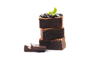 Sliced homemade brownies tower on white isolate background. Sweet and moist of chocolate dessert.