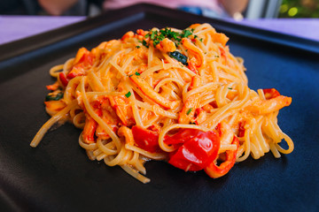 Mediterranean cuisine. pasta with tomatoes and seafood