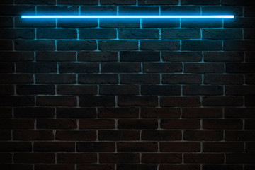 Background texture of empty red brick wall with blue neon light lamp, 80s style glow