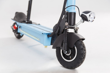Electric scooter with headlight on white