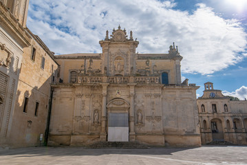 Fototapeta na wymiar Piazza del Duomo square , Virgin Mary Cathedral ( Basilica di Santa Maria Assunta in Cielo ) , Caritas Diocesana in Lecce - Puglia, Italy. Baroque city of Apulia 
