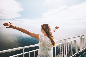 Woman tourist sea traveling by ferry happy raised hands active lifestyle adventure weekend trip...