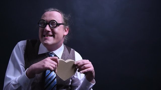 Amorous nerd with a heart as a gift