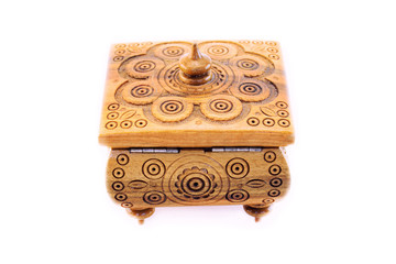wooden old vintage handmade jewelry box casket with threaded patterns isolated on white background