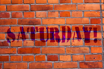 Text sign showing Saturday. Business photo text First day of the weekend Relaxing time Vacation Leisure moment Brick Wall art like Graffiti motivational call written on the wall