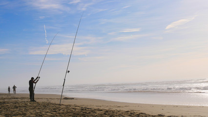 Man fishing on the beach