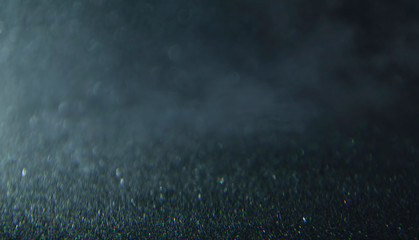 Bokeh mystical fog defocused glittering lights blurred abstract gray black dark  background