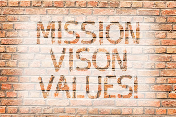 Fototapeta na wymiar Text sign showing Mission Vison Values. Business photo text planning for future improvement Career Right decisions Brick Wall art like Graffiti motivational call written on the wall