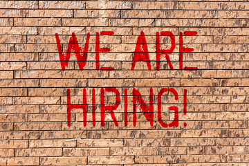 Word writing text We Are Hiring. Business photo showcasing Talent Hunting Job Position Wanted Workforce HR Recruitment Brick Wall art like Graffiti motivational call written on the wall