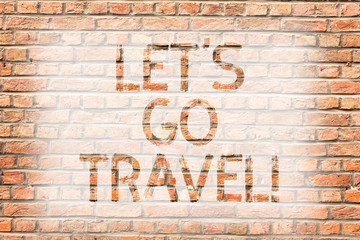 Fototapeta na wymiar Text sign showing Let S Go Travel. Business photo text Going away Travelling Asking someone to go outside Trip Brick Wall art like Graffiti motivational call written on the wall