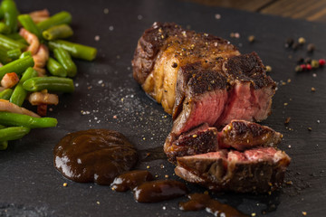 grilled steak from beef sirloin with green beans and bacon