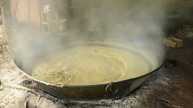 Sugar Cane Juice Boiling in the Container to Making Jaggery