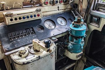 Control panel inside the train driver's cab in the old train. The retro dashboard inside driver cabin. Mechanical control in historical locomotive.
