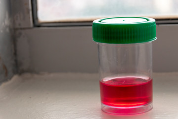 A jar of red liquid