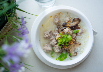Rice soup on white table.