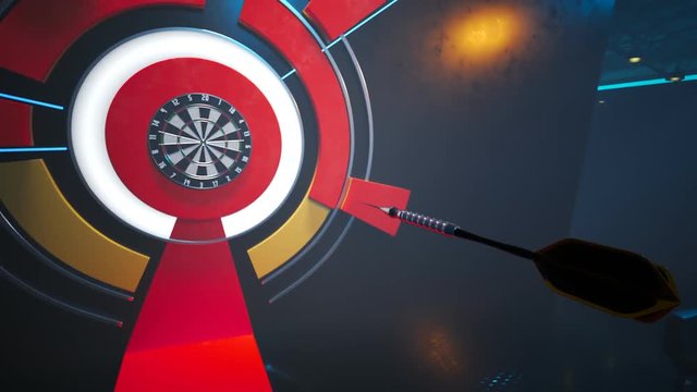 Player throwing a dart hitting perfectly in the bullseye of the dartboard.