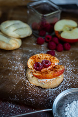 Polish cuisine - crispy, baked bread with yogurt, cinnamon, chilli, apples and raspberries
