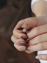 female hands with french manicure and ring
