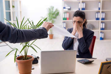 Young female employee being fired from her work