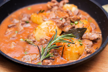 Goulash, beef, pork stew in cast iron pan, top view, close up - Image