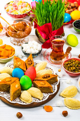 Colored eggs, wheat springs and sweet pastry for Nowruz Holiday in Azerbaijan. Selective focus.