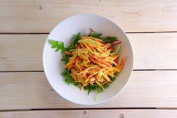 Spring salad with apple, carrot, crab meat, bell pepper and mustard sauce