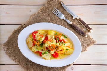 Shrimp stew with potato, paprika, carrot and onion