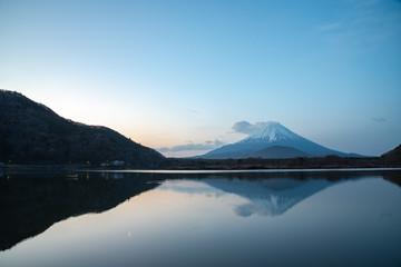 Fototapeta na wymiar Mount Fuji, the World Heritage, view at Lake Shoji ( Shojiko ) in the morning. Mt. Fuji reflection on sunrise. Fuji Five Lake region, Yamanashi prefecture, Japan. Landscape for travel destination.