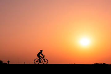 Fototapeta na wymiar ride a bicycle ,silhouette background.