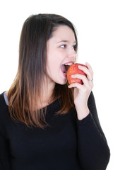 Beautiful young woman eating red apple Isolated on white background