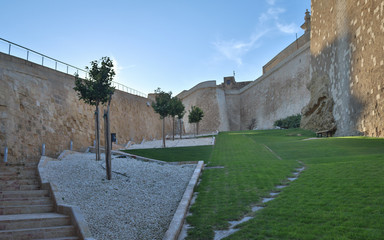 Inside view on the green Park of citadel of Victoria covered with old walls and surrounded with...