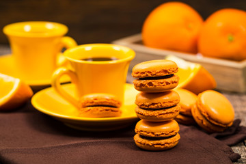 Orange French Macarons with Dark Chocolate and Coffee Filling. Selective focus.