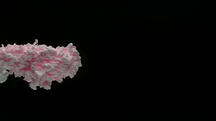 Super slow motion of coloured inks in water. Isolated on black background. Filmed on high speed cinema camera.