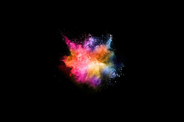 abstract colored dust explosion on a black background.abstract powder splatted background,Freeze motion of color powder exploding/throwing color powder, multicolored glitter texture.