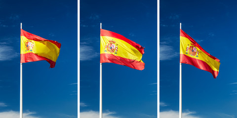 Flaming Spanish flag perched atop a flagpole flailing in the wind