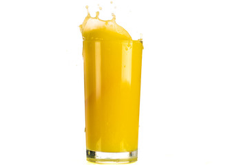 Pouring orange juice into a transparent glass on a white background