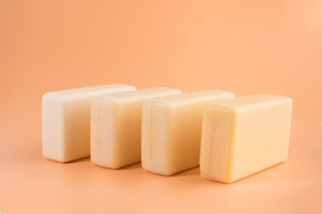 pieces of natural soap isolated on the orange background