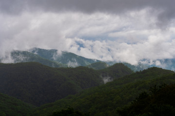 Rain Clouds Cover Dark Green Mountain Tops