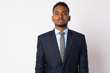 Portrait of young handsome African businessman in suit