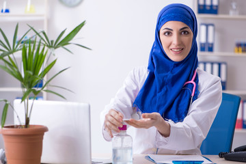 Arab female doctor working in the clinic 