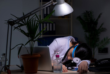 Young female doctor working at night shift 