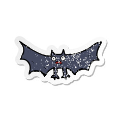 retro distressed sticker of a cartoon bat
