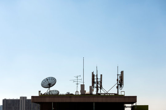 Group of telecomunication antenna and satellite dish
