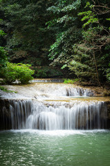 Fototapeta na wymiar Erawan Falls with emerald green ponds in Erawan National Park.