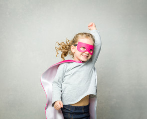 Up and up: little girl playing superhero