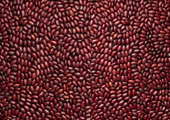 Red beans on the surface as a background. Macro. Close up. Top view. 