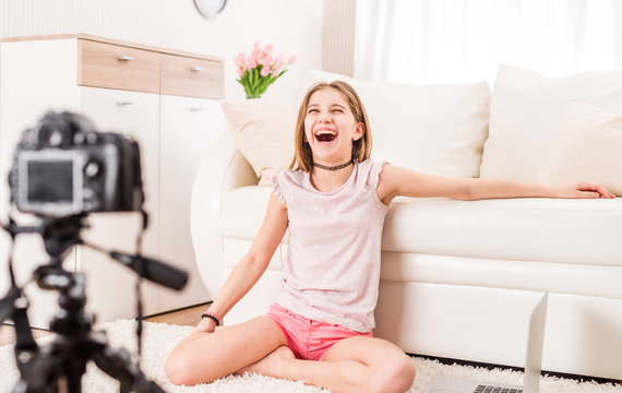 Young smiling videobloger teen girl