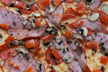 Obraz na płótnie Canvas Pizza with ham and mushrooms photo